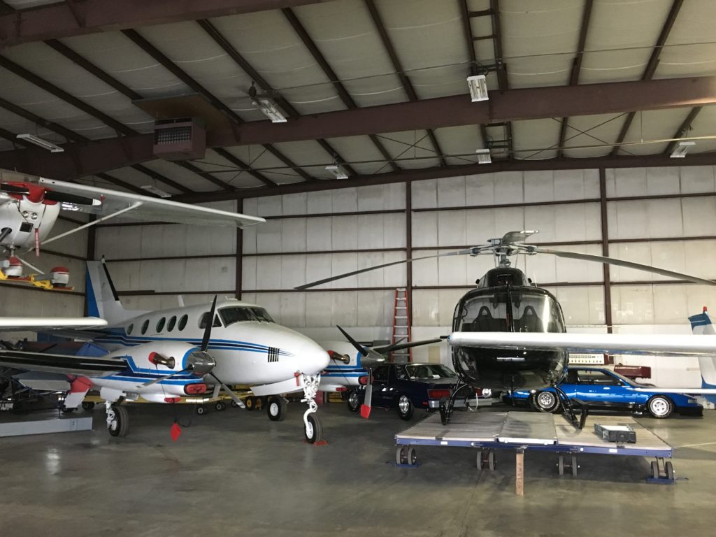 Planes and helicopter in the hangar